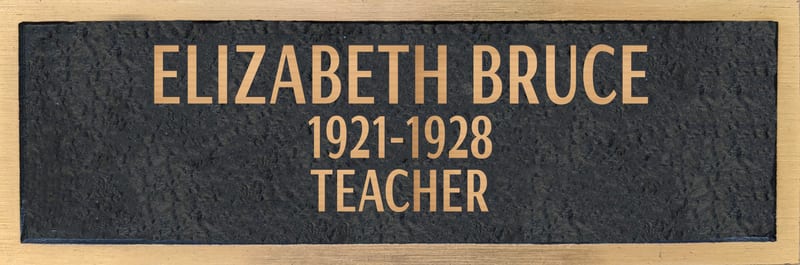 Bronze plaque for Elizabeth Bruce, retired 1928