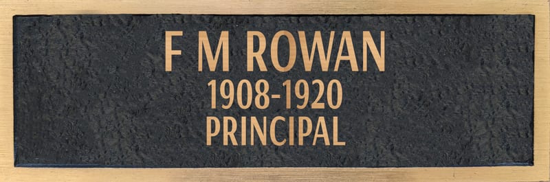 Bronze plaque for F M Rowan, retired 1920